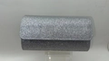 Detail of silver sequin evening clutch bag showing textured finish and flap closure - Silver Glitter Material