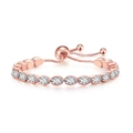 Macro detail of rose gold tennis bracelet with oval cut white zircons and pull chain - 4*6mm Oval Stone / Rose Gold