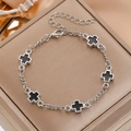 Silver stainless steel bracelet with black cross charms on a luxury jewelry box - Silver Black Cross Pendant Bracelet (7906)
