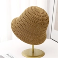 Caramel hollow knit bucket hat with breathable mesh pattern on a gold display stand - M (56-58cm) / Camel