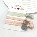 Detail of floral printed hair ties with tassel and heart pendant on a display card - Pink Series - Happiness (12)