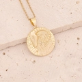 Detailed view of 18K gold plated Aries zodiac pendant necklace on a natural stone surface - 12#Capricorn