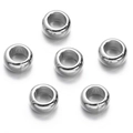 Detailed view of six bright silver CCB spacer beads with large holes on white background - Silver Style 19 (Large Hole Round)