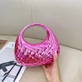 Detail of a shiny pink metallic quilted handbag in a semi-moon shape for evening wear - Rose Red