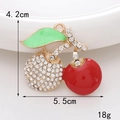 Macro shot of rhinestone cherry charm with dimensions 4.2cm by 5.5cm weighing 18g - D392 Cherry