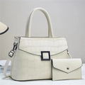 Detail of stone pattern embossed cream shoulder bag with matching envelope clutch set - Off-white