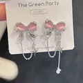 Detail van S925 zilveren strik oorbellen met roze opaal en fijne ster kwastjes - 925 Zilveren Naald/Legering/Kattenoogsteen / Roze Kattenoogsteen Strik Kwastje