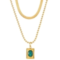 Detail of layered double-strand gold snake chain with green gemstone pendant necklace - Gold Color F48
