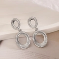 Silver double ring drop earrings with zircon stones on a luxury display stand - Silver Double Oval Style