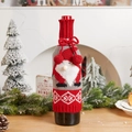 Knitted Christmas wine bottle cover with gnome motif and festive snowflake pattern - Santa Claus