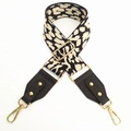 Detail of adjustable black and white leopard print strap with leather and gold hardware - Beige Spots