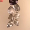 Detail showing tiered silver leaf fringe earrings with a metallic glossy finish - Silver Leaf Tassel Style / Silver