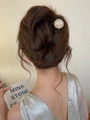 U-shaped hair pin with marble bead detail shown in an elegant updo hairstyle - Translucent Black Jade