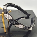 Fashionable twisted headband with black and white rhinestones and anti-slip teeth - Black and White Stone