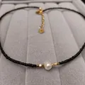 Minimalist freshwater pearl necklace with black beads and gold-tone spacers on display - Black Freshwater Pearl Necklace (38+5CM)