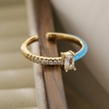 Detail of 18K gold-plated ring with blue enamel, rectangle zircon and micro-inlaid stones - Adjustable Open / Blue