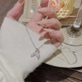 Elegant silver mermaid tail necklace featuring a pink crystal and white pavé setting - X262 Silver Fishtail Pink Stone