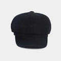 Detailed view of the black octagonal beret hat with button top and fine twill texture - Black