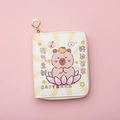 Detailed macro view of cream-colored Capybara wallet with gold zipper and lucky charms - Cream White - Constant Luck