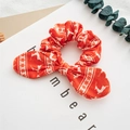 Red Christmas scrunchie with white deer and snowflake patterns and a bow detail - Red Reindeer
