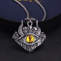 Macro detail of gothic skull pendant with yellow evil eye and vintage metal texture - Standard Type / Yellow
