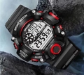 Macro shot of a black and red waterproof tactical sport watch on rugged outdoor wet rocks - Red