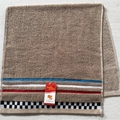 Brown cotton towel featuring decorative checkered striped borders and a soft terry texture - Digital Khaki Towel