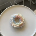 Elegant pleated scrunchie in pastel pink and blue stripe fabric on a white dish - Pink and Blue