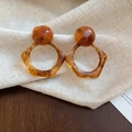 Detailed view of 14K gold plated earrings with brown tiger eye resin on linen fabric - 50# Silver Earring Post Coffee Pentagon