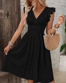 Detailed close-up of V-neck embroidery and ruffled sleeves on a black eyelet cotton dress - S / Black