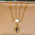 Gold-tone layered necklace featuring white pearls and a black gemstone oval pendant - Gold Double Layer Pearl Gemstone Style (N2959)