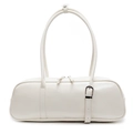 White minimalist leather baguette pillow bag with slim handles and silver metal buckle - White