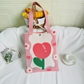Detail of pink knitted tote bag with red tulip heart pattern and magnetic clasp - Pink Tulip