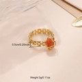 Detailed view of adjustable gold-plated chain ring featuring an orange natural stone - Gold Band + Orange Red Stone / Red