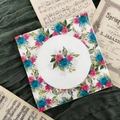 Square floral printed napkins featuring blue and pink roses on a deep green backdrop - Blue Pink Flower