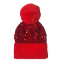 Close-up of red sequined knit hat with fluffy pompom and plush velvet faux fur trim - Red