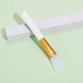 Silicone face mask brush with white handle, gold ferrule and translucent soft head - White
