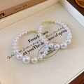 Orecchini a cerchio dorati con perle sfumate dal design irregolare ed elegante - Cerchio Irregolare di Perle Ago in Argento