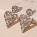 Detailed view of silver heart earrings with rhinestone inlay and hammered metal texture - Silver (S925 Silver Needle)