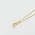 Minimalist gold necklace featuring a letter J pendant with a honeycomb faceted surface - L