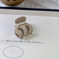 Detail of beige resin hair claw clip with elegant inlaid pearls on a French vintage style base - Small 3.5cm / Khaki