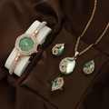 Detailed set showing gold quartz watch with green gems, necklace, earrings, and ring - Green Peacock Set