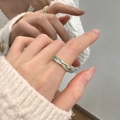 Detailed close-up of golden ring with green enamel wave pattern and mirror reflection - Gold Enamel (JZ0617)