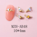 Detail of 10x4mm gold heart nail charm with AB rhinestones on a pink nail tip - Gold Heaven's Light Style (AB48) / 10 Pieces Pack