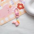 Close-up of pink resin bunny keychain holding a carrot with matching pink D-ring hook - Pink Carrot Rabbit