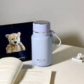 Matte light purple stainless steel insulated bottle with silver lid and silicone strap - 650ml / Lavender