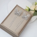 Silver butterfly earrings with long tassels and sparkling rhinestones on a jewelry box - Silver Full Rhinestone Butterfly Tassel
