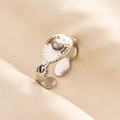 Detail of adjustable silver ring featuring white marble stone and hammered metal texture - Silver White Gemstone Style (J514-S-W)