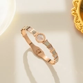 Rose gold geometric bangle with shell inlay and roman numerals on white background - Rose Gold