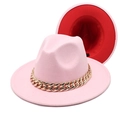 Detail of pink fedora featuring a chunky gold chain and contrasting red inner lining - Pink + Red
